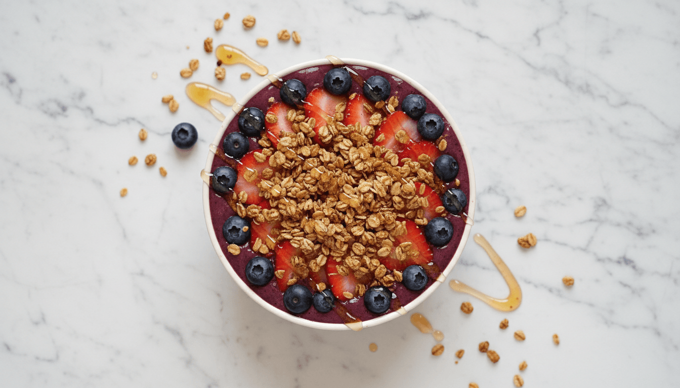 Acai smoothie bowl with strawberries and granola in bright natural light